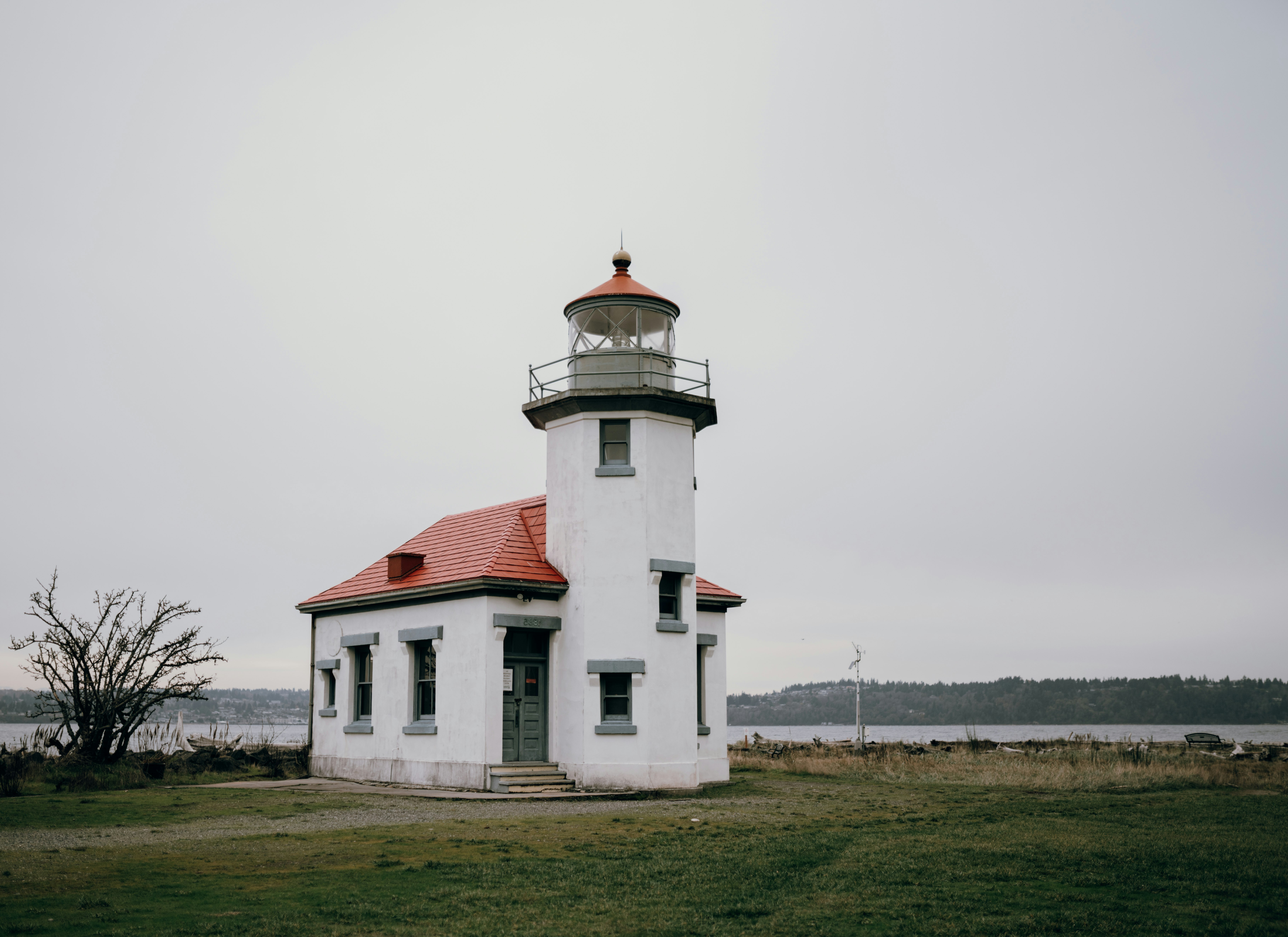 white and red concrete lighthouse